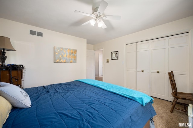 bedroom featuring ceiling fan and a closet