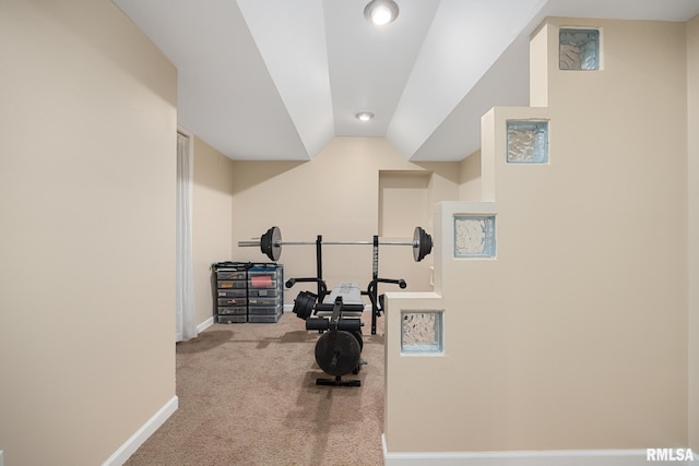 workout area featuring carpet floors, baseboards, vaulted ceiling, and recessed lighting
