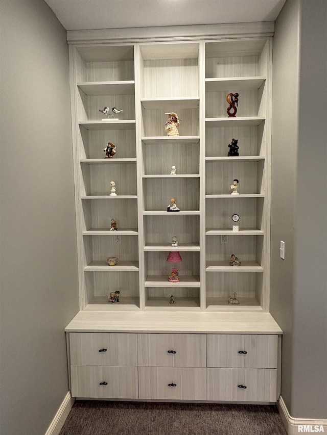 detailed view of baseboards and carpet floors