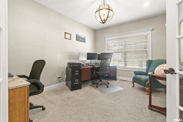 carpeted office with baseboards and a chandelier