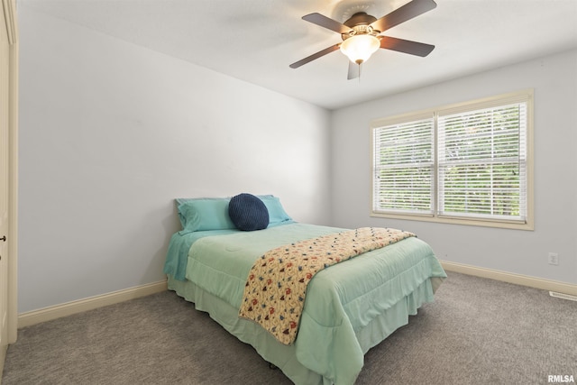 bedroom with baseboards, carpet, and a ceiling fan