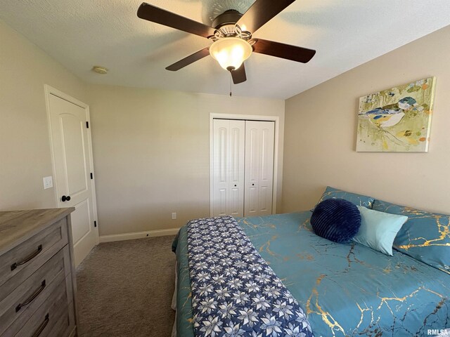 carpeted bedroom featuring a closet, a ceiling fan, and baseboards