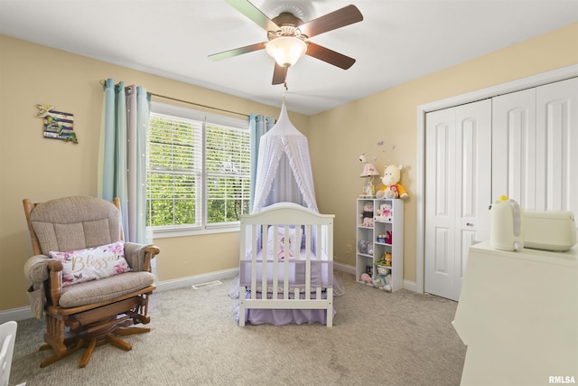 bedroom featuring a closet, carpet flooring, and baseboards