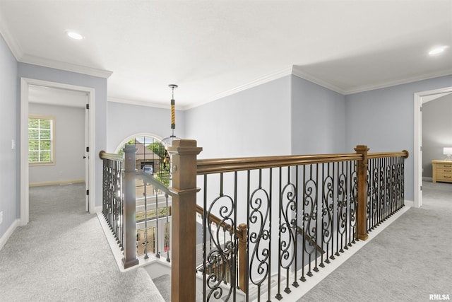 corridor featuring carpet, an upstairs landing, baseboards, crown molding, and recessed lighting