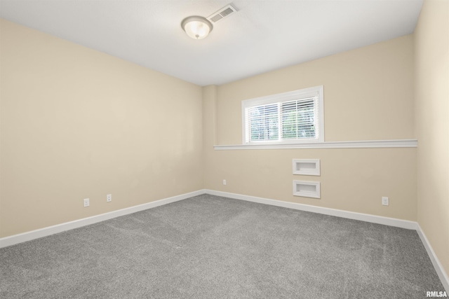 spare room with carpet floors and baseboards