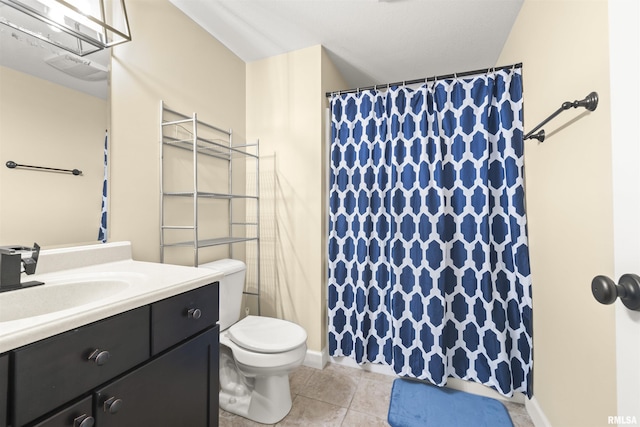 bathroom featuring tile patterned flooring, toilet, vanity, and a shower with shower curtain