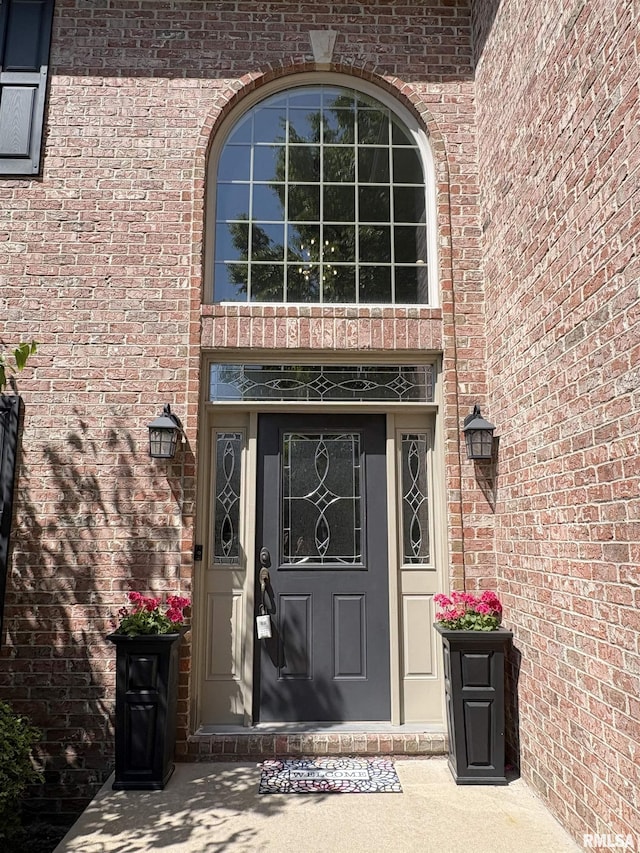 entrance to property with brick siding