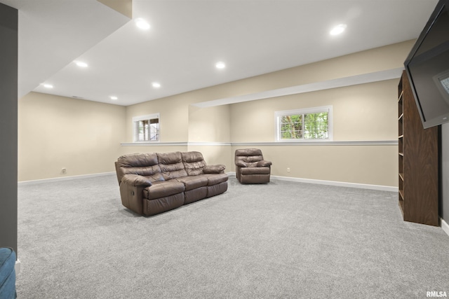 living area with carpet floors, baseboards, recessed lighting, and plenty of natural light