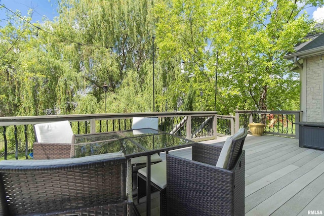 wooden terrace featuring outdoor dining space