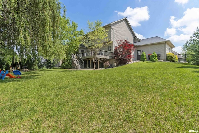 back of property featuring a wooden deck and stairs
