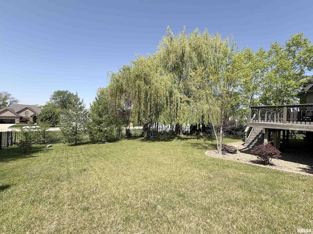 view of yard featuring stairway and a wooden deck