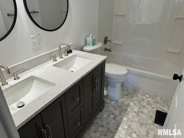 bathroom featuring toilet, double vanity, and bathing tub / shower combination