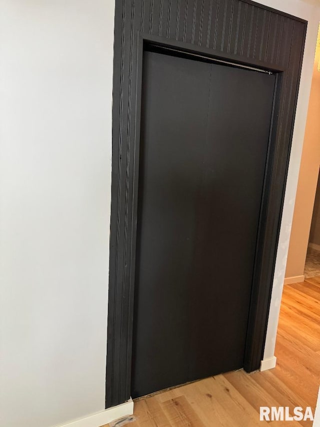 detailed view of wood finished floors and baseboards