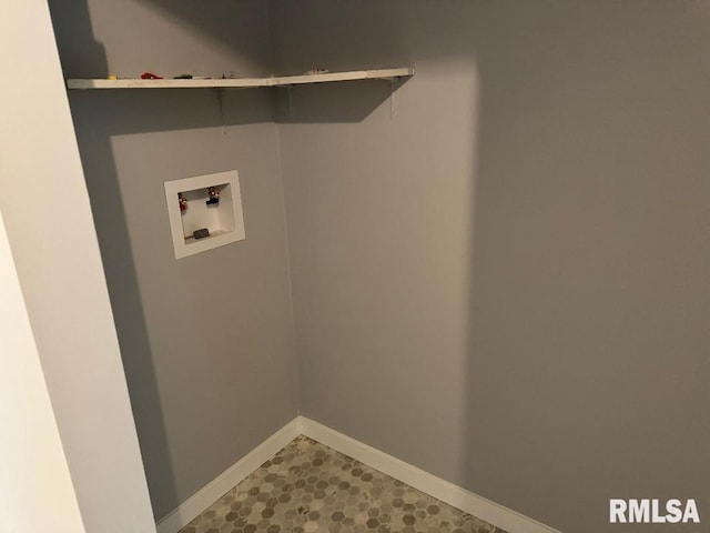 laundry area with washer hookup and baseboards