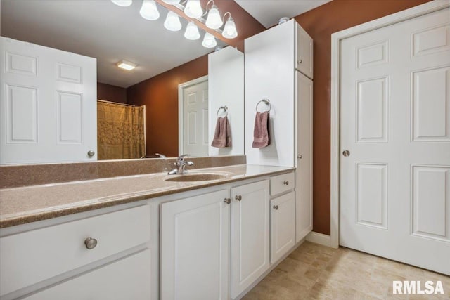 2512 Stonehenge Ct Unit 7Ashv, Peoria, IL 61615 - bathroom featuring vanity and baseboards