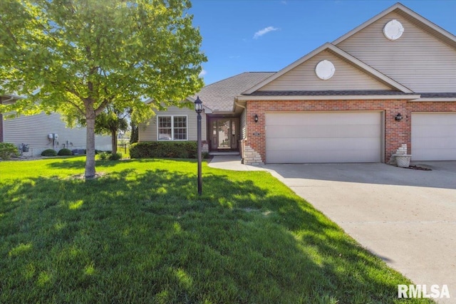 2512 Stonehenge Ct Unit 7Ashv, Peoria, IL 61615 - view of front of property with a garage, a front lawn, driveway, and brick siding