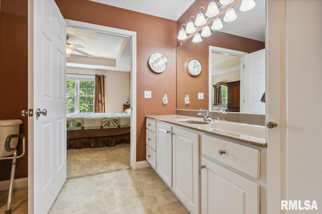 2512 Stonehenge Ct Unit 7Ashv, Peoria, IL 61615 - ensuite bathroom featuring vanity, baseboards, and ceiling fan