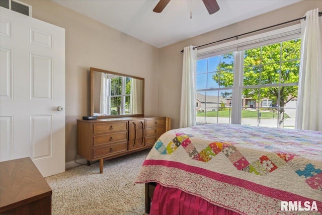 2512 Stonehenge Ct Unit 7Ashv, Peoria, IL 61615 - carpeted bedroom featuring multiple windows and ceiling fan