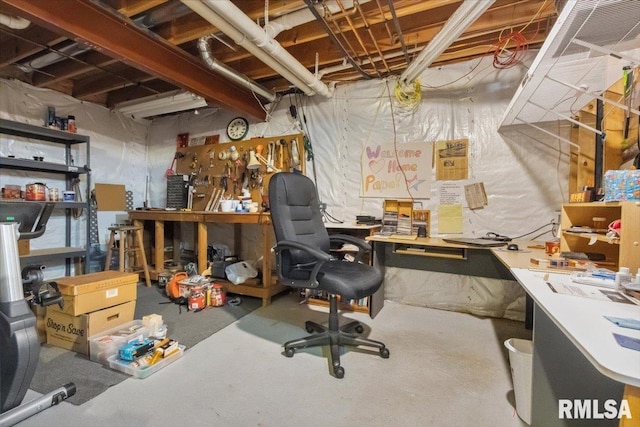 2512 Stonehenge Ct Unit 7Ashv, Peoria, IL 61615 - unfinished basement with a workshop area