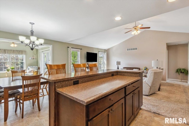 2512 Stonehenge Ct Unit 7Ashv, Peoria, IL 61615 - kitchen with open floor plan, pendant lighting, vaulted ceiling, a ceiling fan, and dark countertops