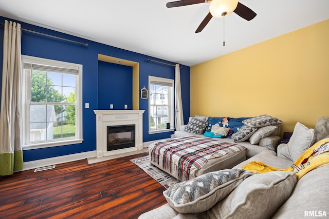 3329 W King James Rd, Peoria, IL 61615 - living room featuring healthy amount of natural light, hardwood / wood-style floors, baseboards, and ceiling fan