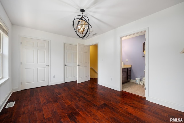 3329 W King James Rd, Peoria, IL 61615 - unfurnished bedroom featuring hardwood / wood-style flooring, a chandelier, baseboards, and ensuite bathroom