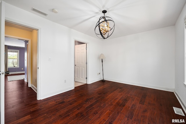 3329 W King James Rd, Peoria, IL 61615 - spare room featuring a chandelier, a smoke detector, wood-type flooring, and baseboards