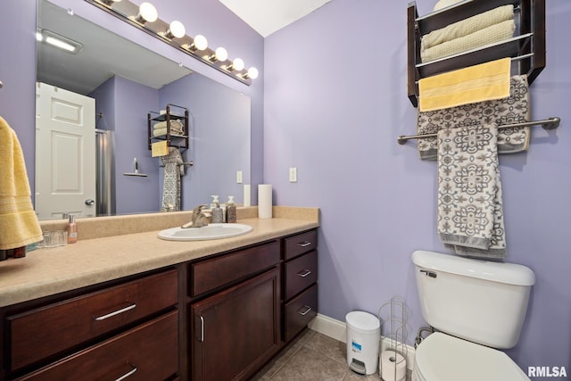 3329 W King James Rd, Peoria, IL 61615 - bathroom featuring tile patterned floors, toilet, vanity, and baseboards