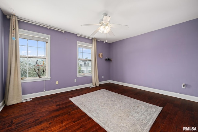 3329 W King James Rd, Peoria, IL 61615 - unfurnished room featuring healthy amount of natural light, baseboards, and hardwood / wood-style flooring