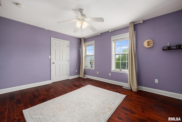 3329 W King James Rd, Peoria, IL 61615 - unfurnished bedroom with baseboards, wood finished floors, and a ceiling fan