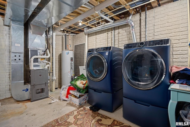 3329 W King James Rd, Peoria, IL 61615 - washroom featuring separate washer and dryer, brick wall, water heater, and heating unit