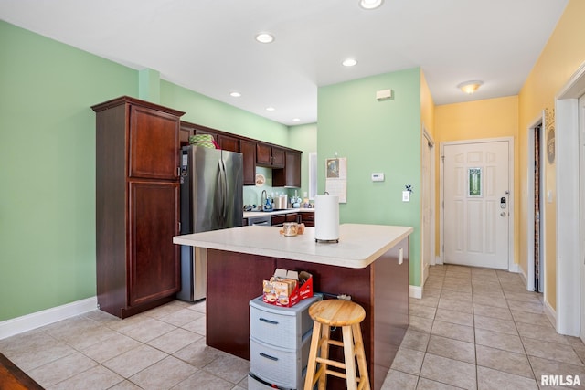 3329 W King James Rd, Peoria, IL 61615 - kitchen featuring freestanding refrigerator, light tile patterned flooring, light countertops, baseboards, and recessed lighting