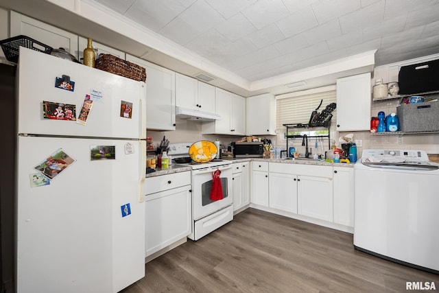 106 Ernest St Unit A & B, Washington, IL 61571 - kitchen featuring white appliances, washer / clothes dryer, under cabinet range hood, a sink, and crown molding