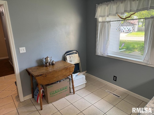 1635 W Country Oaks Ct, Dunlap, IL 61525 - dining room featuring light tile patterned floors and baseboards