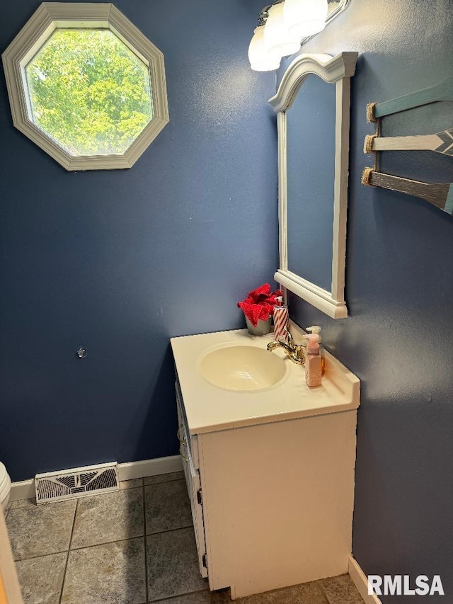 1635 W Country Oaks Ct, Dunlap, IL 61525 - bathroom with vanity, baseboards, tile patterned flooring, and toilet