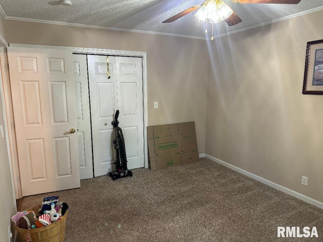 1635 W Country Oaks Ct, Dunlap, IL 61525 - unfurnished bedroom with carpet floors, a closet, ornamental molding, baseboards, and ceiling fan