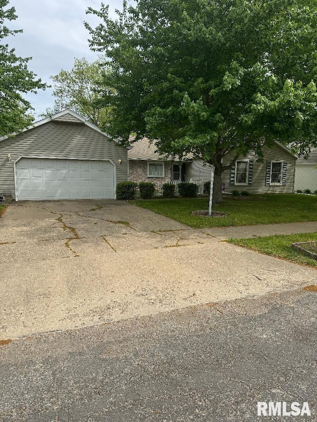 1635 W Country Oaks Ct, Dunlap, IL 61525 - view of front of home featuring concrete driveway, a front yard, and a garage