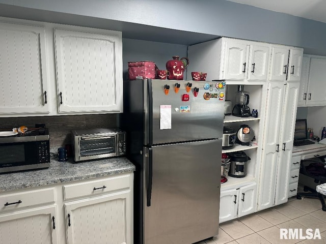 1635 W Country Oaks Ct, Dunlap, IL 61525 - kitchen with stainless steel appliances, light tile patterned flooring, white cabinets, and light stone countertops