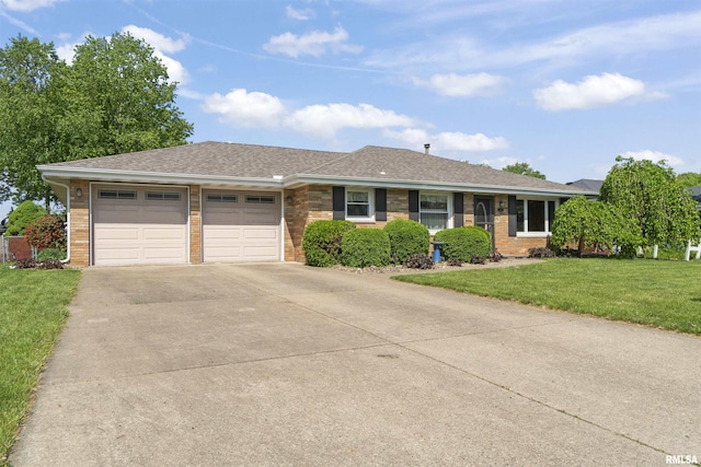 ranch-style home with an attached garage, driveway, brick siding, a front yard, and a shingled roof