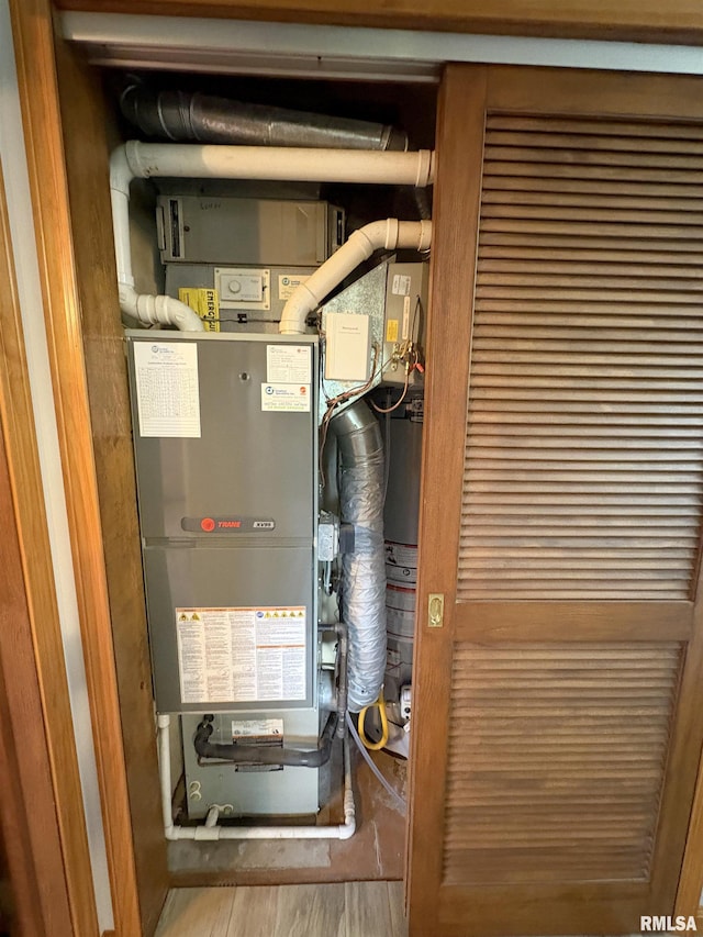 utility room with heating unit