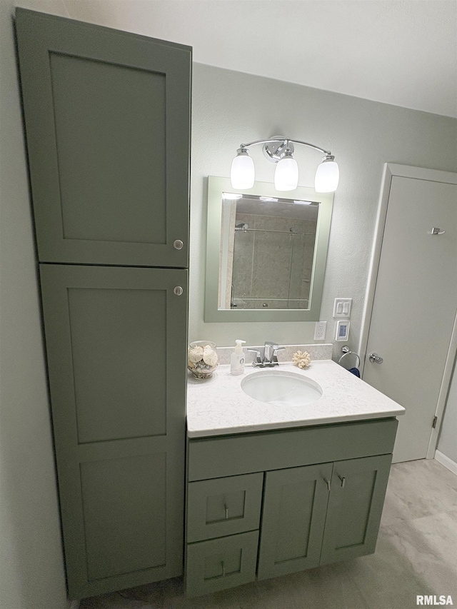bathroom featuring vanity and a shower