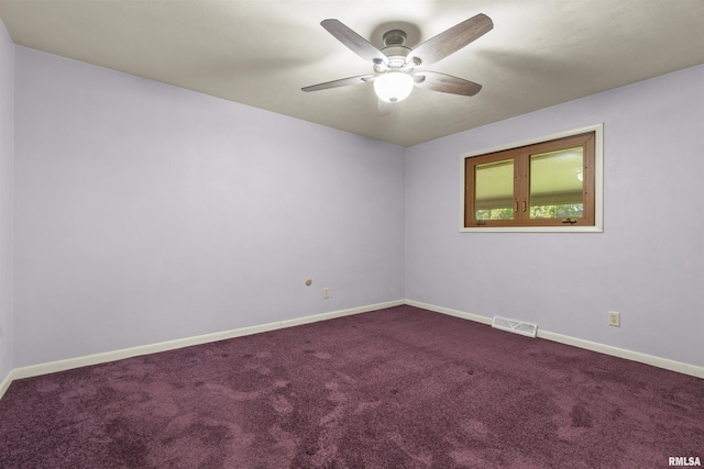 spare room featuring ceiling fan, carpet floors, and baseboards