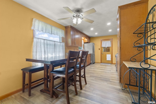 dining space with ceiling fan, baseboards, recessed lighting, and light wood-style floors