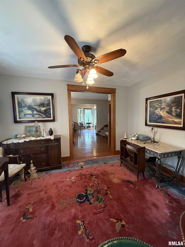 111 N Broadway St, Lewistown, IL 61542 - dining room featuring stairway, a ceiling fan, and baseboards