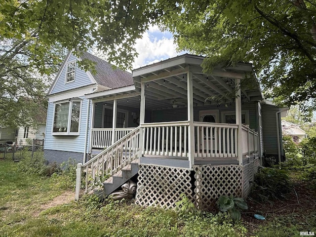 111 N Broadway St, Lewistown, IL 61542 - back of property featuring a porch and roof with shingles