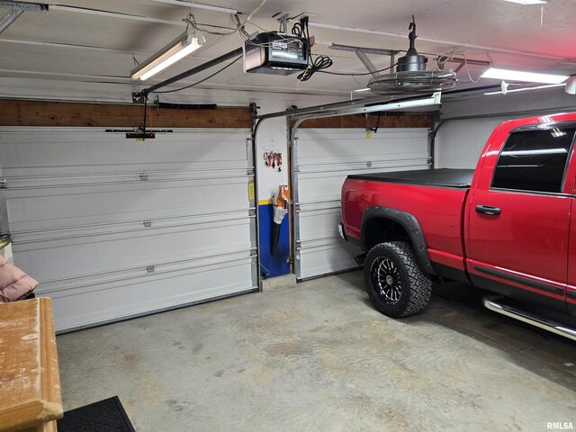 212 Conch Dr, La Harpe, IL 61450 - garage with a garage door opener