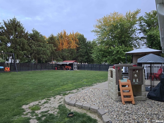 212 Conch Dr, La Harpe, IL 61450 - view of yard featuring a gazebo, a shed, and an outbuilding