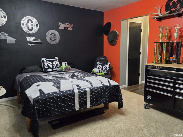 212 Conch Dr, La Harpe, IL 61450 - carpeted bedroom featuring an accent wall