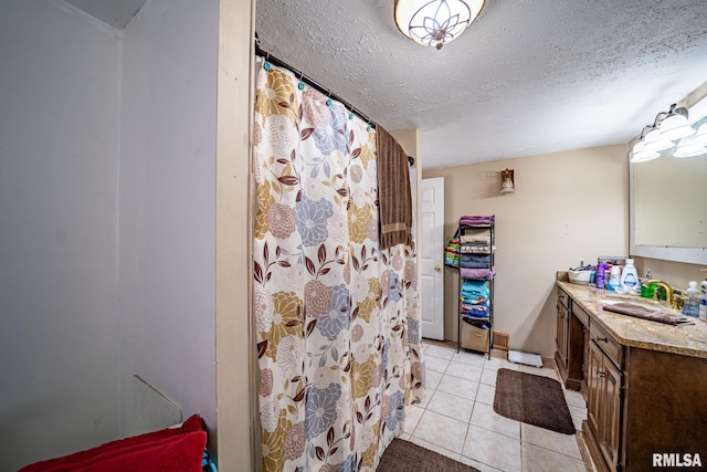 1425 N Vaughn Ave, West Peoria, IL 61604 - bathroom featuring tile patterned flooring, a textured ceiling, vanity, and a shower with curtain