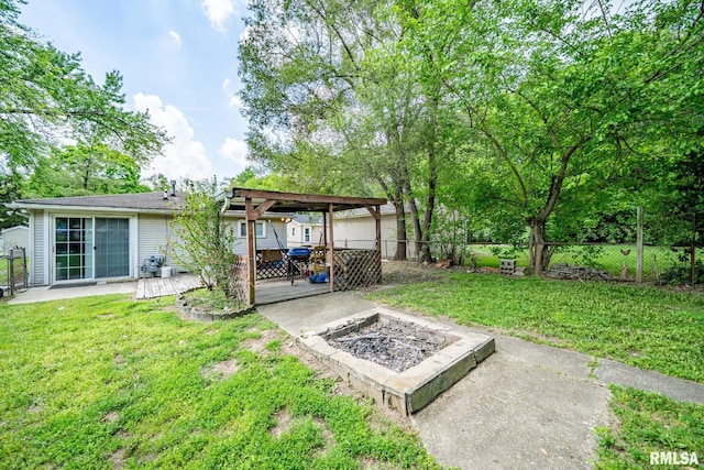 1425 N Vaughn Ave, West Peoria, IL 61604 - view of yard with a fire pit, a patio, and a deck